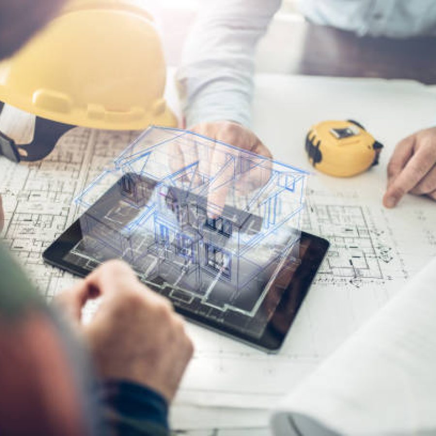 PROJETO 3D Architect and his client looking at the hologram of a house project over a tablet computer. The client is reviewing his future house layout
Note to inspector: I am the author of the building project